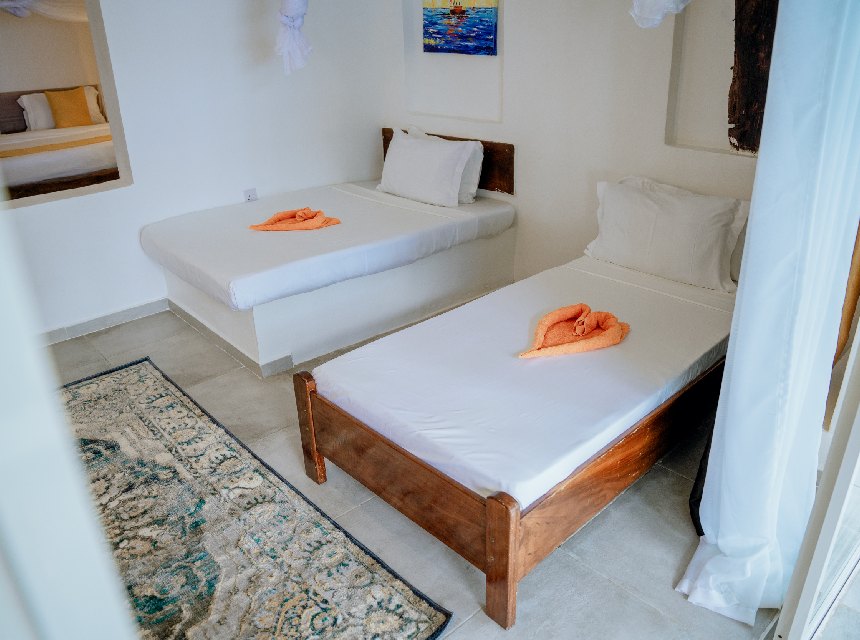 Family Sea View room with twin beds and tiled floors