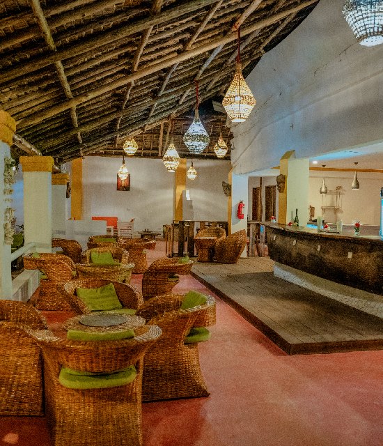The resort lounge and bar with rattan chairs and hanging lanterns